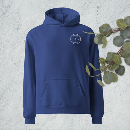 Curling oversized hoodie with embroidered encouragement on the sleeve and curling house printed on the back
